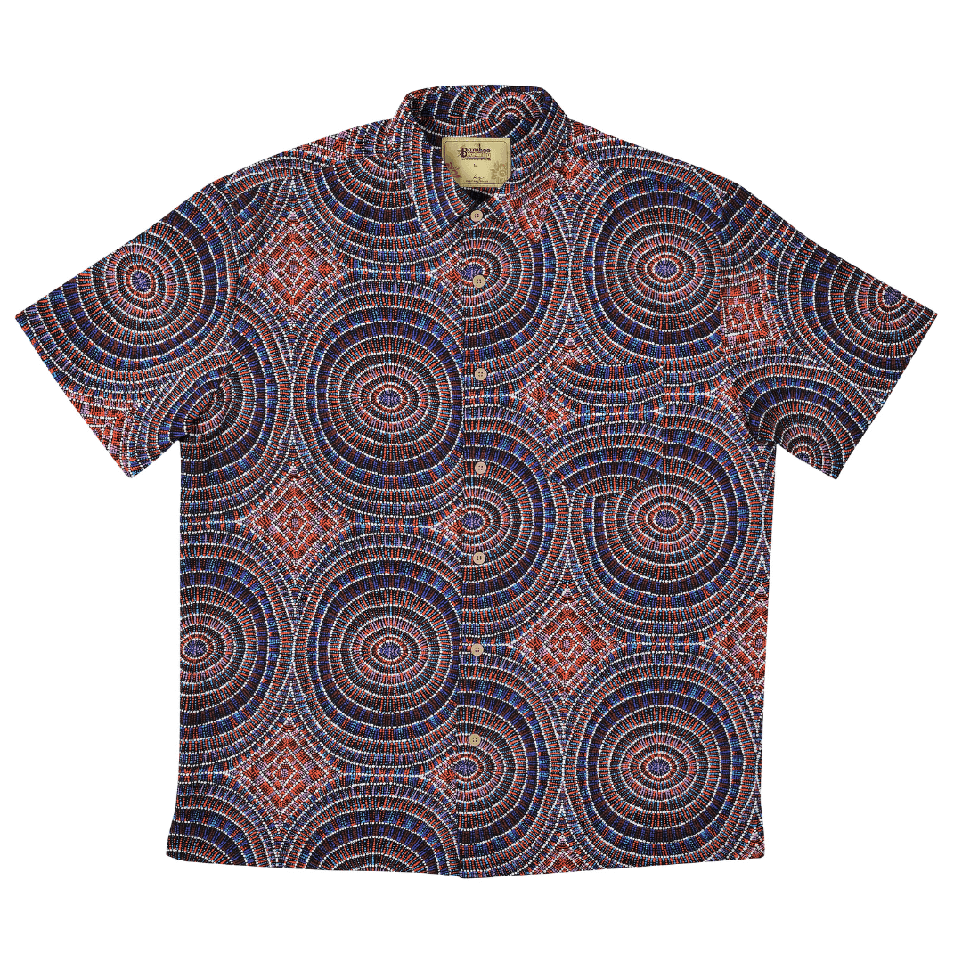 Stewart's Menswear, Mullumbimby. Kingston Grange Bamboo Dreaming Shirt. Print is called Janmarda Jukurrpa. An indigenous print shirt with large spirals all over. Blue/Clay colourway.