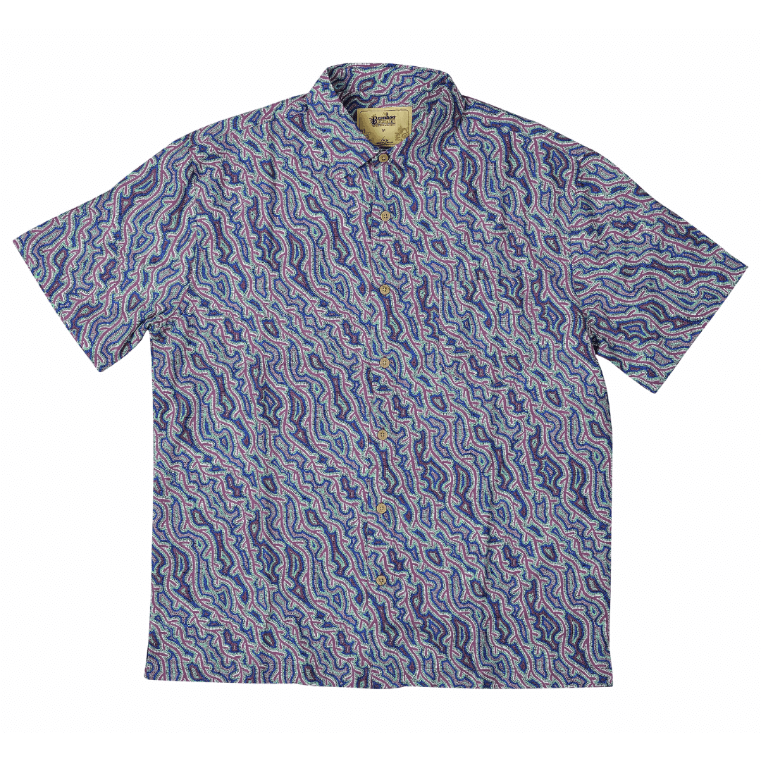 Stewart's Menswear, Mullumbimby. Kingston Grange Bamboo Dreaming Shirt. Print is called Yarla Jukurrpa. An indigenous print shirt with water like two tone blue and lilac design.