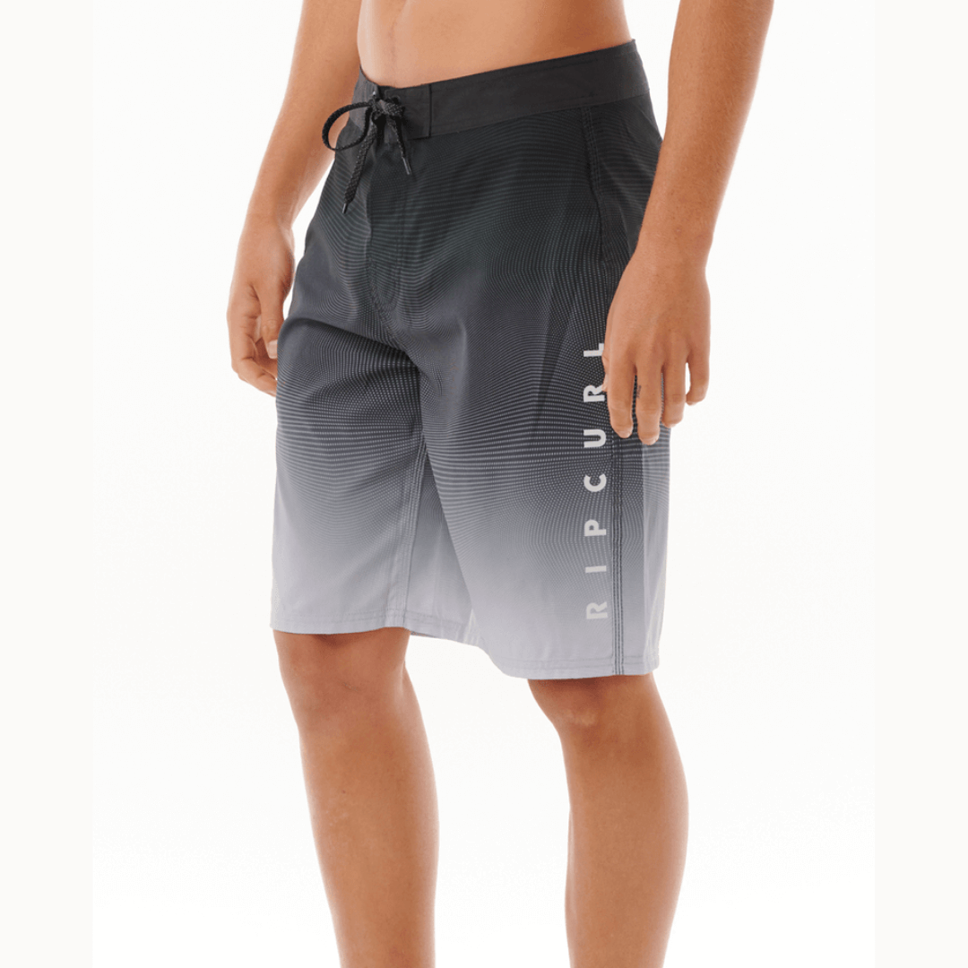 Stewarts Menswear Rip Curl Shock Boardshort. Photo shows side view of model wearing Rip Curl Shock Boardshorts. Colour is Black.