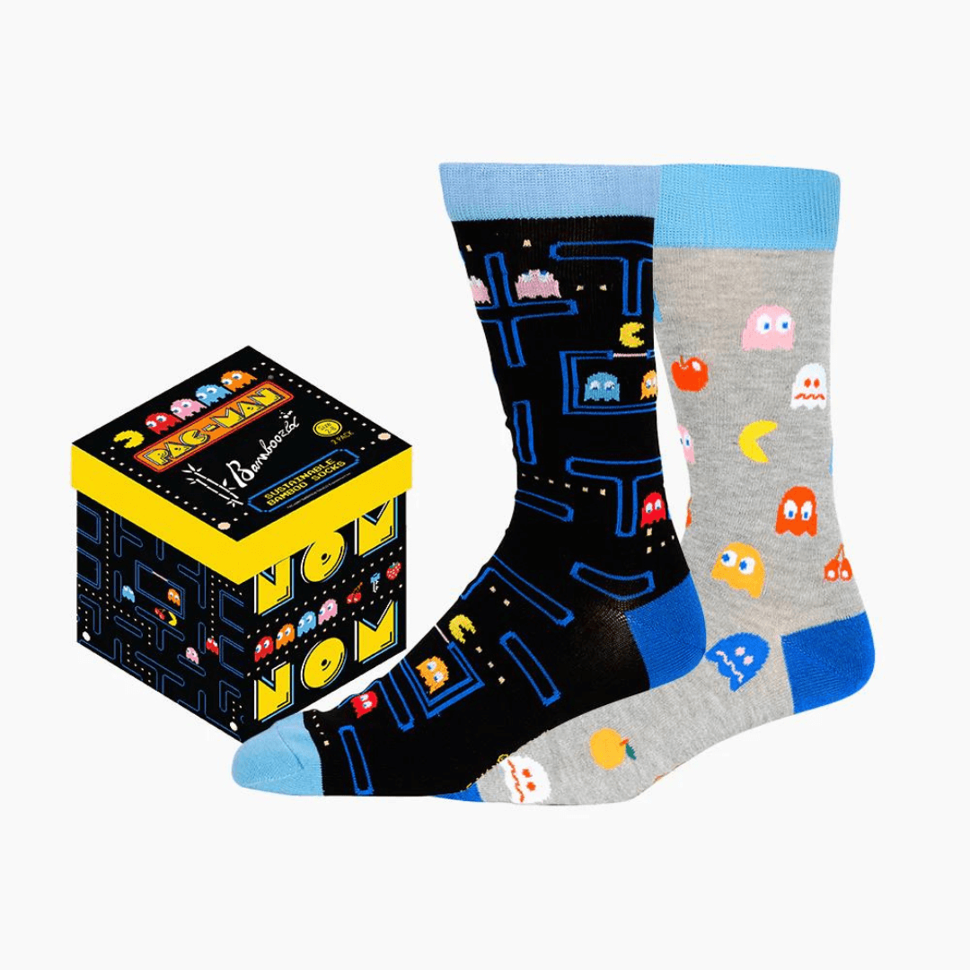 Stewarts Menswear Bamboozled socks 2 pack gift box. This Gift Box is the perfect gift, featuring two pairs of novelty crew socks packaged in a matching Gift Box. Bamboozld Gift Boxes have a vibrant collection of quirky bamboo-blend socks which pack a playful punch. Theme is Pacman. One x black socks, one by grey socks.