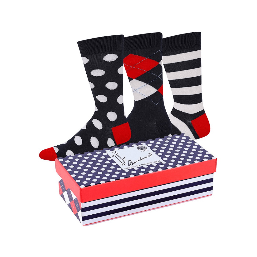 Stewarts Menswear Bamboozled socks 3 pack gift box. Spots and Stripes, Navy. Stewarts Menswear Bamboozled socks 3 pack gift box. This Gift Box is the perfect gift, featuring three pairs of novelty crew socks packaged in a matching Gift Box. Bamboozld Gift Boxes have a vibrant collection of quirky bamboo-blend socks which pack a playful punch. 1 x navy with white spots, 1 x navy with white stripes, 1 x navy with plaid design.