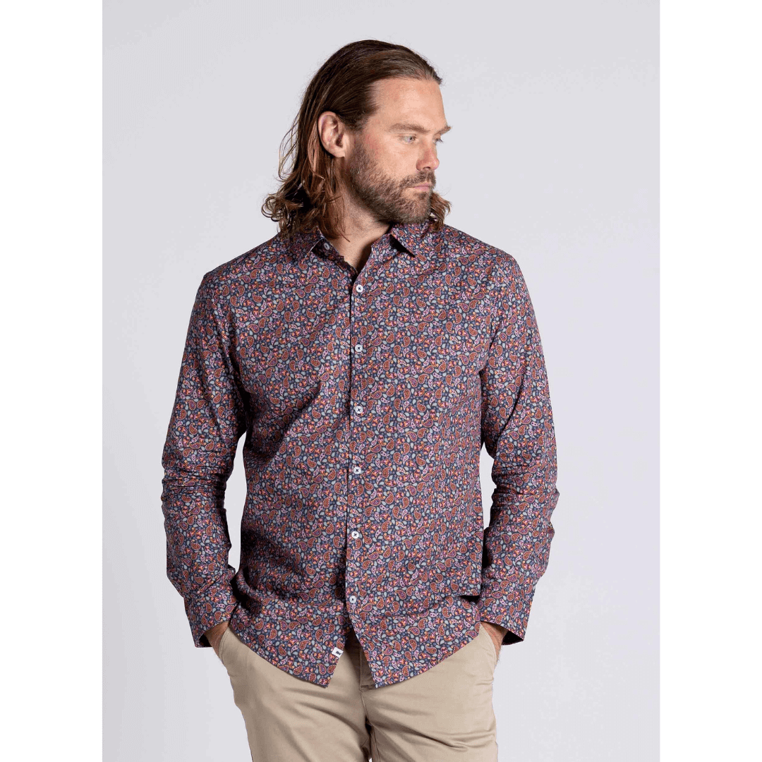 Stewart's Menswear Blackwood Apparel Garrat long sleeve shirt. A modern paisley print in maroon tones makes the Garrat Long Sleeve Shirt a standout piece. Photo shows model wearing Blackwood Garrat long sleeve shirt, close up view.