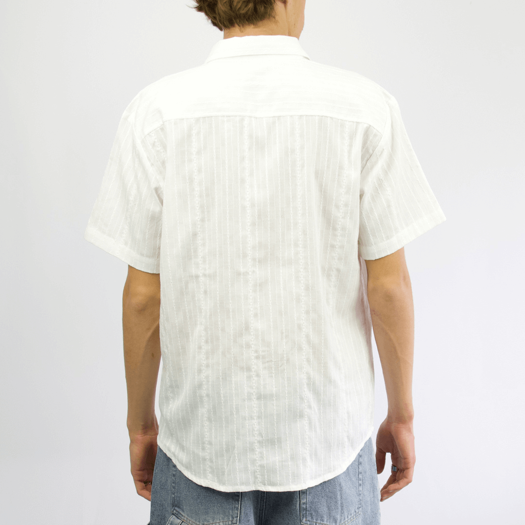 Back view of Carve Otto Short Sleeve Shirt available at Stewart’s Menswear Mullumbimby. Regular-fit white cotton-linen men’s shirt with textured stripe and button front.