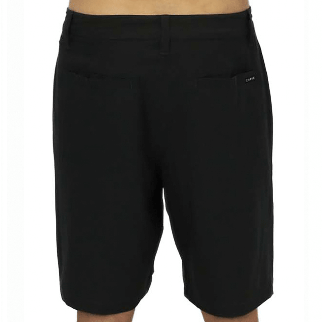 Back view of Carve Pelagic Walk Short in black, men's quick dry stretch hybrid shorts with side pockets and Carve logo badge on the leg, available at Stewart's Menswear Mullumbimby.