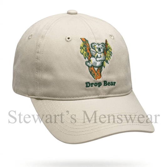 Drop Bear Cap in stone, a 6-panel cap with an embroidered koala in a gum tree and Drop Bear lettering, available at Stewart's Menswear Mullumbimby.