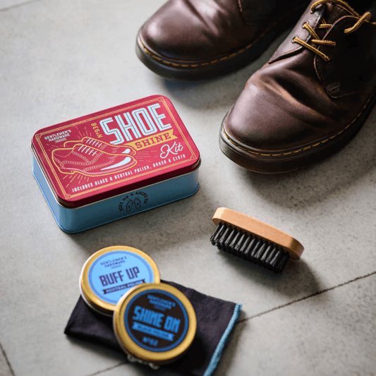 Gentleman's Hardware Shoe Shine Kit in tin with black and neutral polish, brush and cloth, available at Stewart's Menswear Mullumbimby (lifestyle Photo)