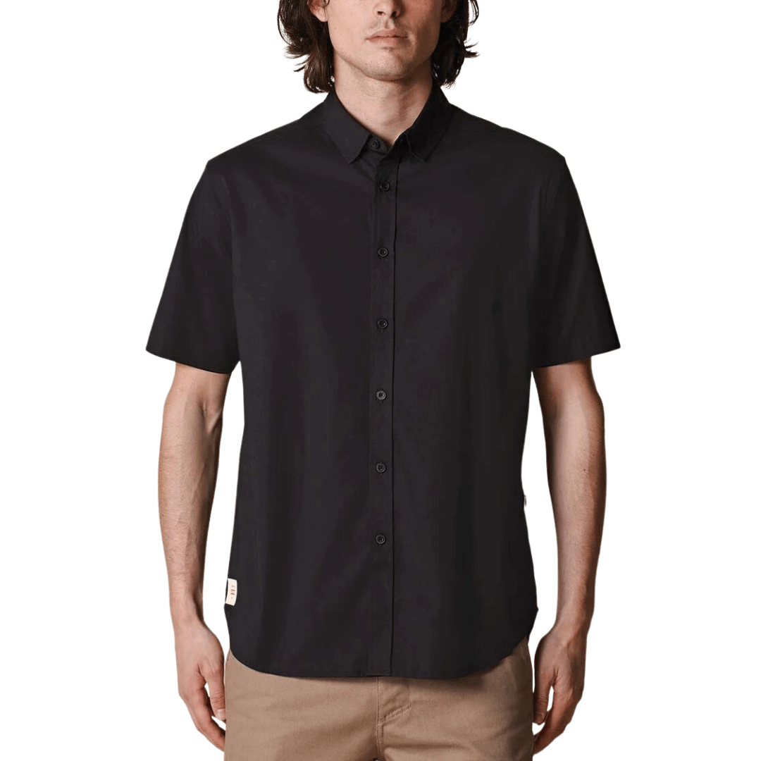 Stewarts Menswear Globe foundation short sleeve shirt - Black. The Globe Foundation Short Sleeve Shirt is your go-to button-up for every occasion. Crafted with comfort, durability, and eco-awareness in mind, this shirt is the perfect blend of style and sustainability. support sustainable fashion and make a positive impact on the environment. Join the conscious consumer movement and embrace fashion that cares for the planet.