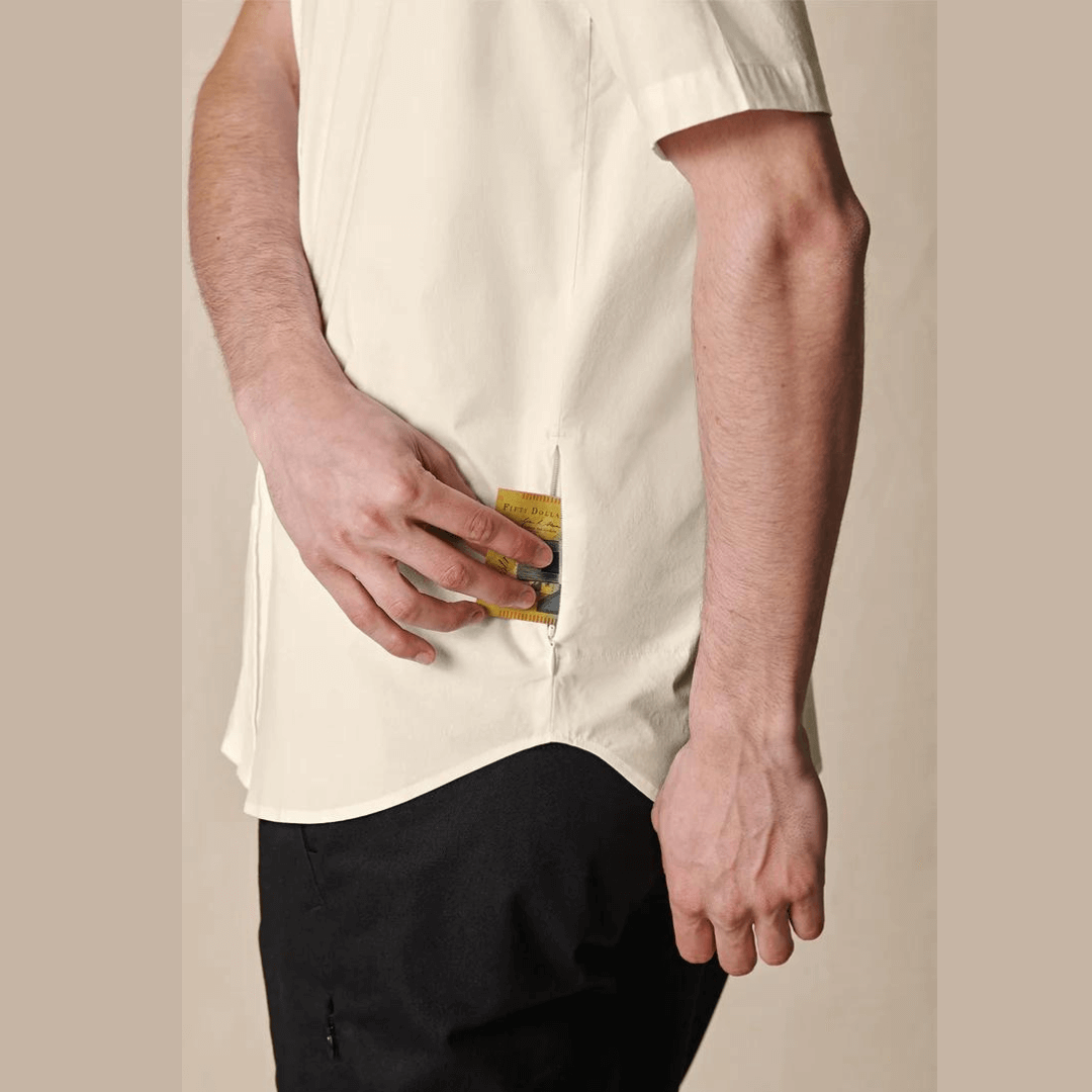 Stewarts Menswear Globe foundation short sleeve shirt - bleach free/dye free. The Globe Foundation Short Sleeve Shirt is your go-to button-up for every occasion. Crafted with comfort, durability, and eco-awareness in mind, this shirt is the perfect blend of style and sustainability. support sustainable fashion and make a positive impact on the environment. Join the conscious consumer movement and embrace fashion that cares for the planet. Photo shows concealed zip stash pocket.