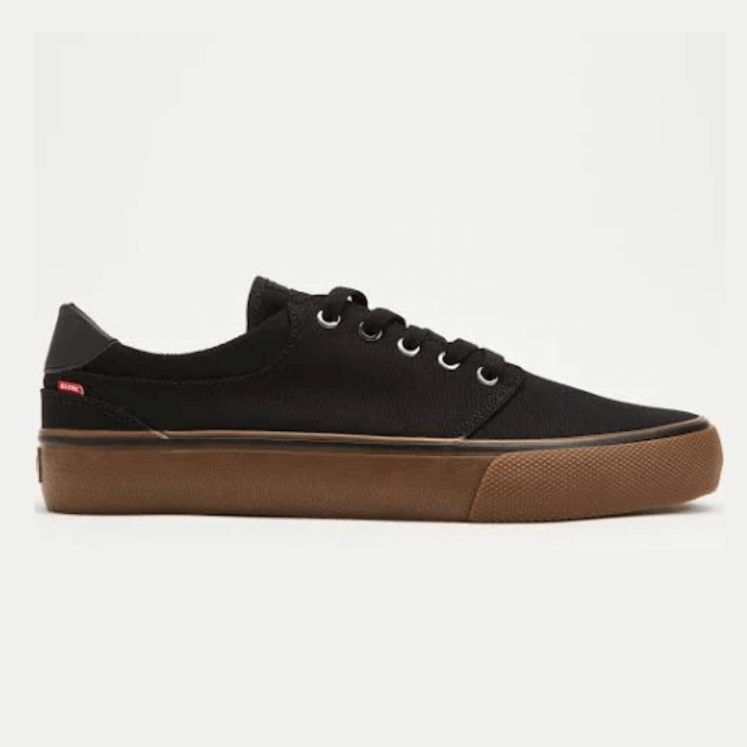 Stewarts Menswear Globe Goodstock Skate shoe. Colour is black with gum coloured sole. Photo shoes side-view of Goodstock skate shoe.
