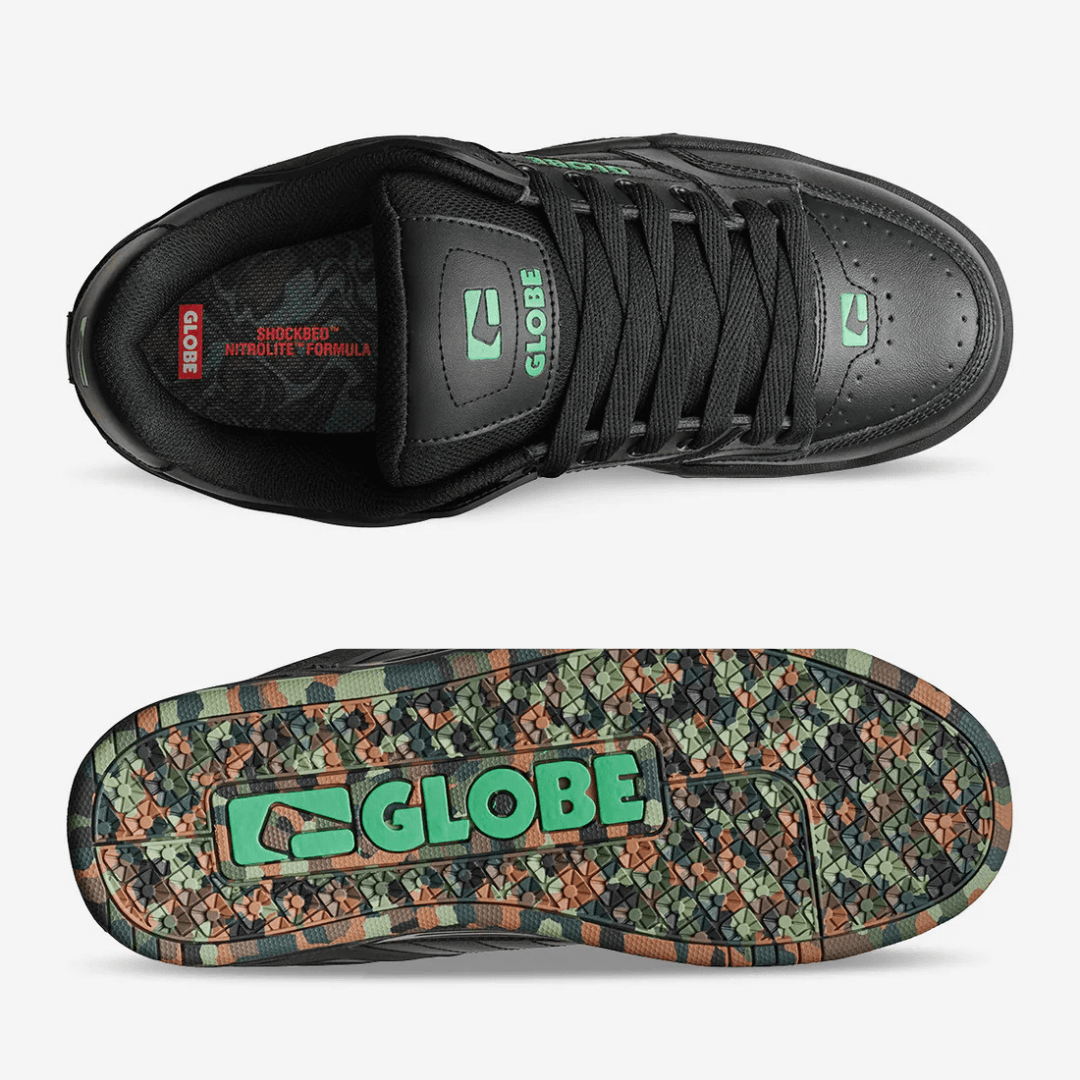 Stewart's Menswear, Mullumbimby. Globe Skate Shoe Tilt Black/Green/Mosaic. Photo shows top view and sole view of shoe. Predominantly black bulky style skate shoe with Green Globe branding. Sole is mosaic camo colours.