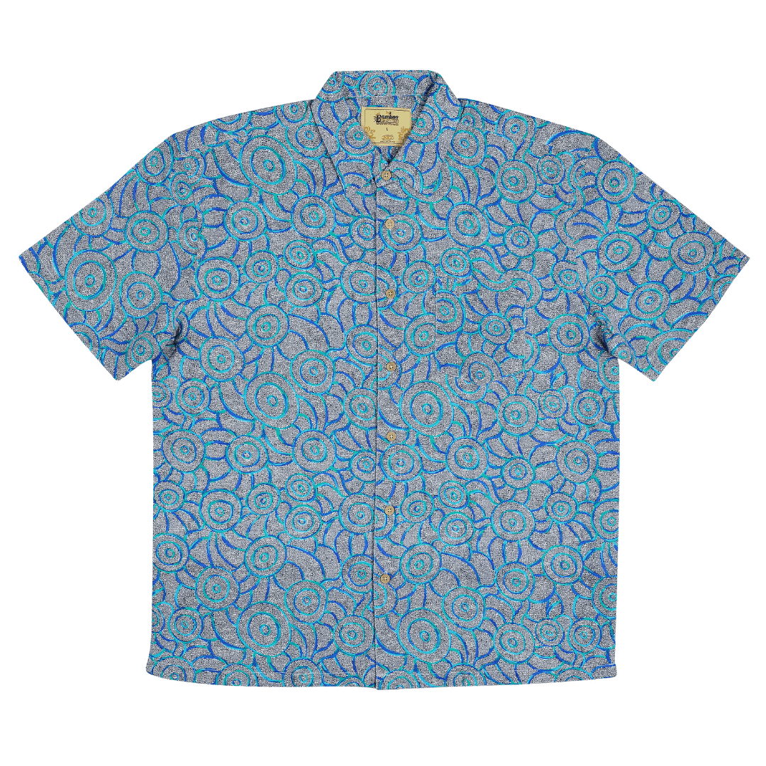 Stewart's Menswear Kingston Grange Bamboo Dreaming men's short sleeve shirt. Bamboo clothing is perfect to wear in our climate and it’s better for the planet too! Bamboo clothing feels soft and silky, a very luxurious fabric which is comfortable to wear. It’s anti static so it sits on the body nicely without clinging. It is also hypoallergenic, breathable and absorbent. This shirt named Bush Possum features aboriginal circular print in shades of blue, grey and aqua.