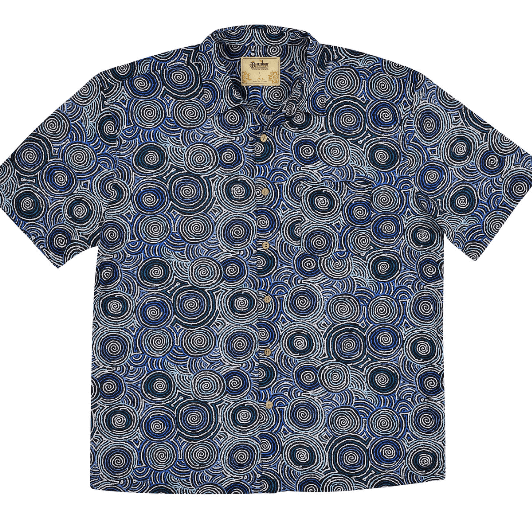 Stewart's Menswear Kingston Grange Bamboo Dreaming men's short sleeve shirt - Mina Mina. Bamboo clothing is perfect to wear in our climate and it’s better for the planet too! Bamboo clothing feels soft and silky, a very luxurious fabric which is comfortable to wear. It’s anti static so it sits on the body nicely without clinging. It is also hypoallergenic, breathable and absorbent. This men's bamboo shirt named Mina Mina features aboriginal circular print in shades of blue.