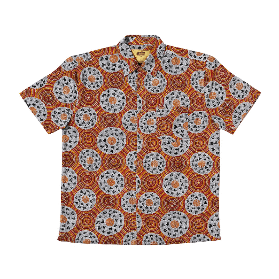 Stewart's Menswear Kingston Grange Bamboo Dreaming men's short sleeve shirt. Bamboo clothing is perfect to wear in our climate and it’s better for the planet too! Bamboo clothing feels soft and silky, a very luxurious fabric which is comfortable to wear. It’s anti static so it sits on the body nicely without clinging. It is also hypoallergenic, breathable and absorbent. This men's bamboo shirt named Marlu has an aboriginal circular dot print in shades of white, terracotta, yellow and natural red tones.