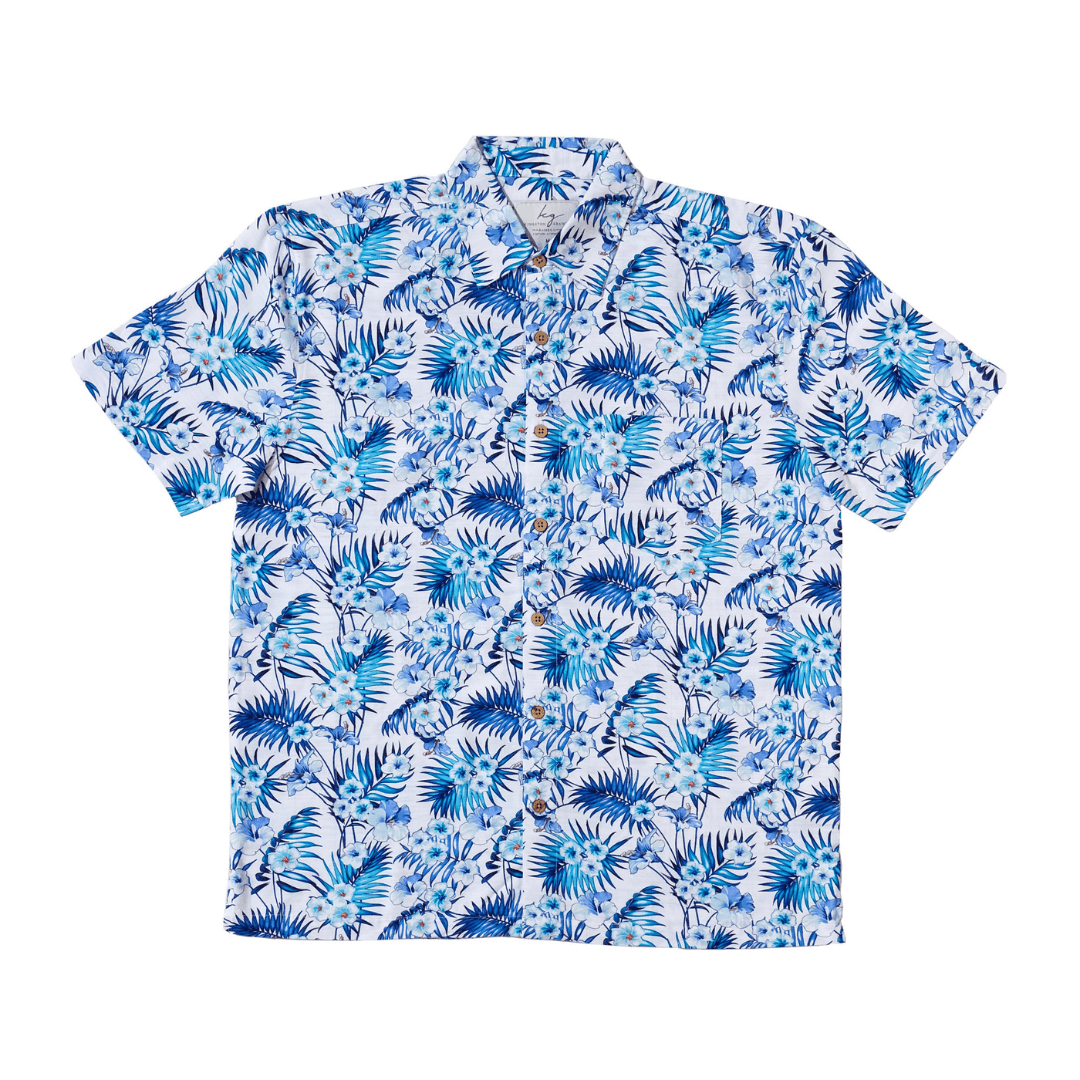 Stewarts Menswear Kingston Grange Bamboo shirt. Bamboo clothing is perfect to wear in our climate and it’s better for the planet too! Bamboo clothing feels soft and silky, a very luxurious fabric which is comfortable to wear. It’s anti static so it sits on the body nicely without clinging. It is also hypoallergenic, breathable and absorbent. This shirt which is named "Noose Heads" has a white background with tropical blue and aqua flowers and leaves printed all over.