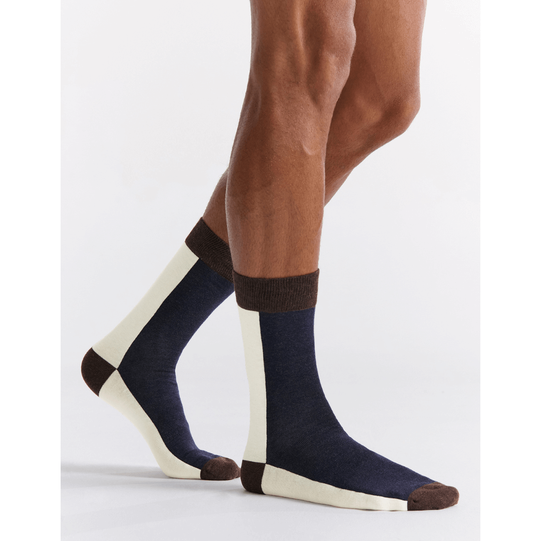 Stewarts Menswear, Mullumbimby. Ambra Bamboo two tone crew socks. Photo shows model wearing Ambra bamboo two tone crew socks. Split colour, back of sock is cream, front of sock is navy blue with chocolate toe, heel and top trim.