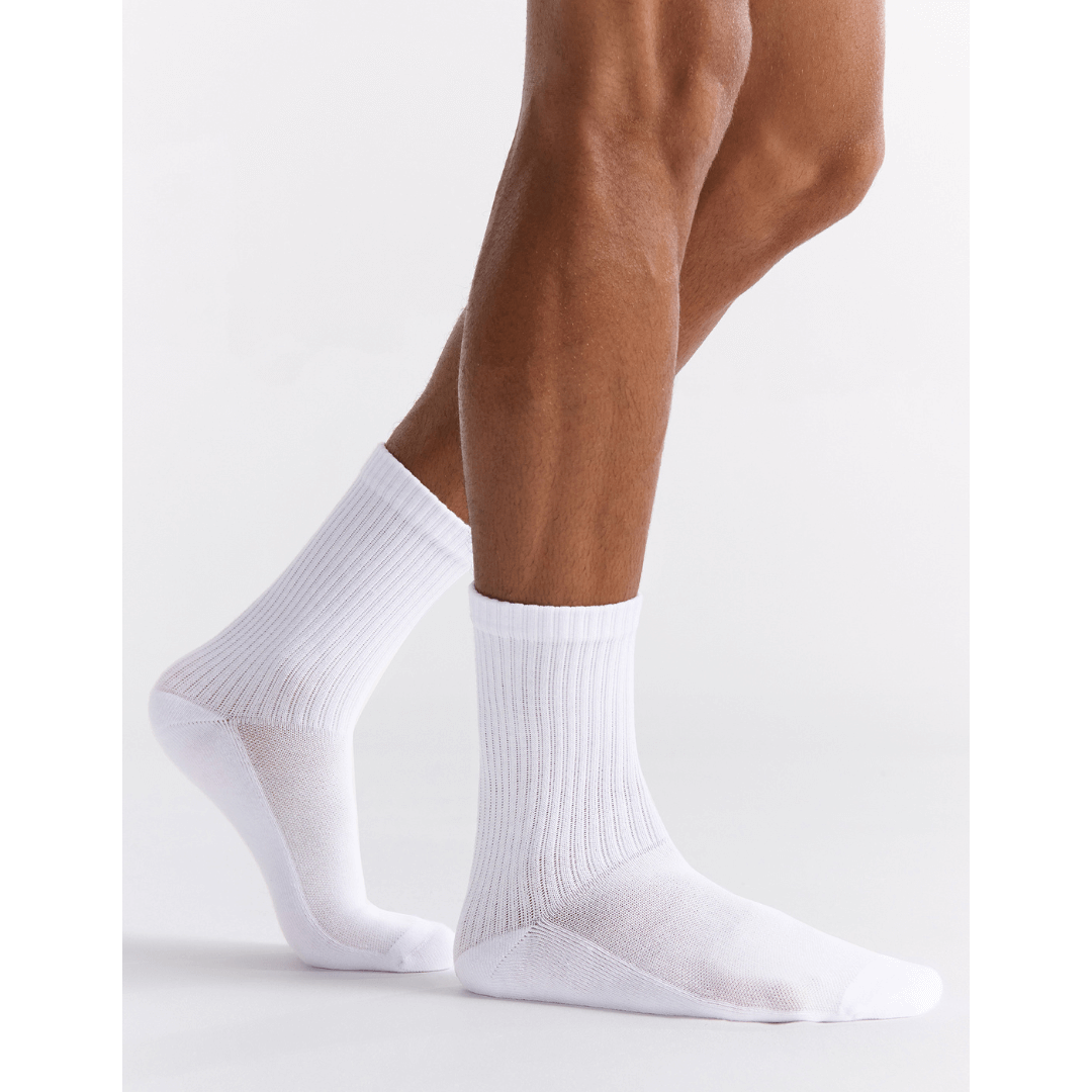 Stewarts Menswear Mullumbimby. Ambra men's active high ankle socks. Photo shows model wearing Ambra men's active high ankle socks. Colour is White.