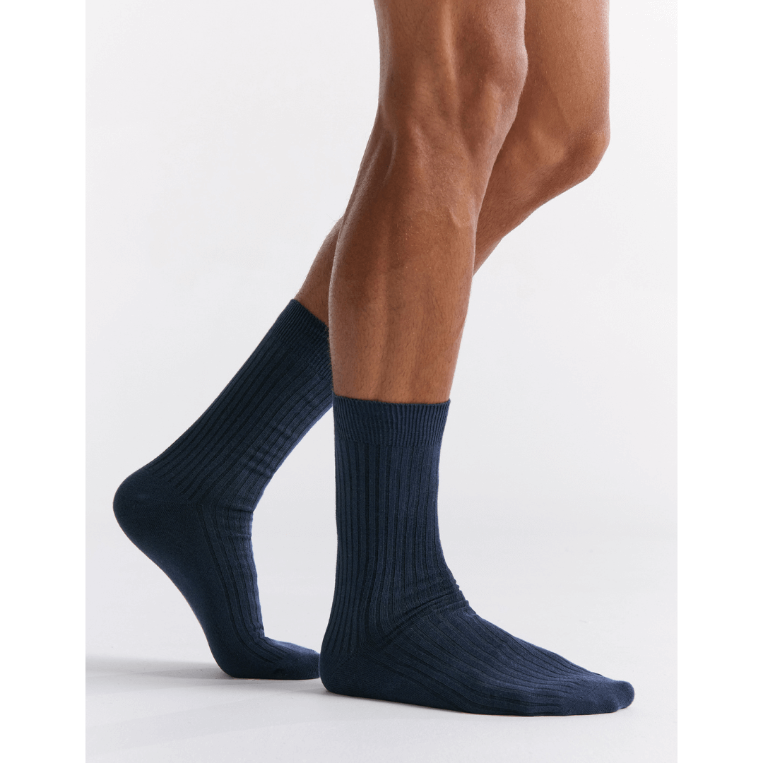 Stewarts Menswear Mullumbimby. Ambra Men's Organic Cotton Crew Socks. Photo shows model wearing Ambra organic cotton crew socks in Eclipse (Navy Blue)