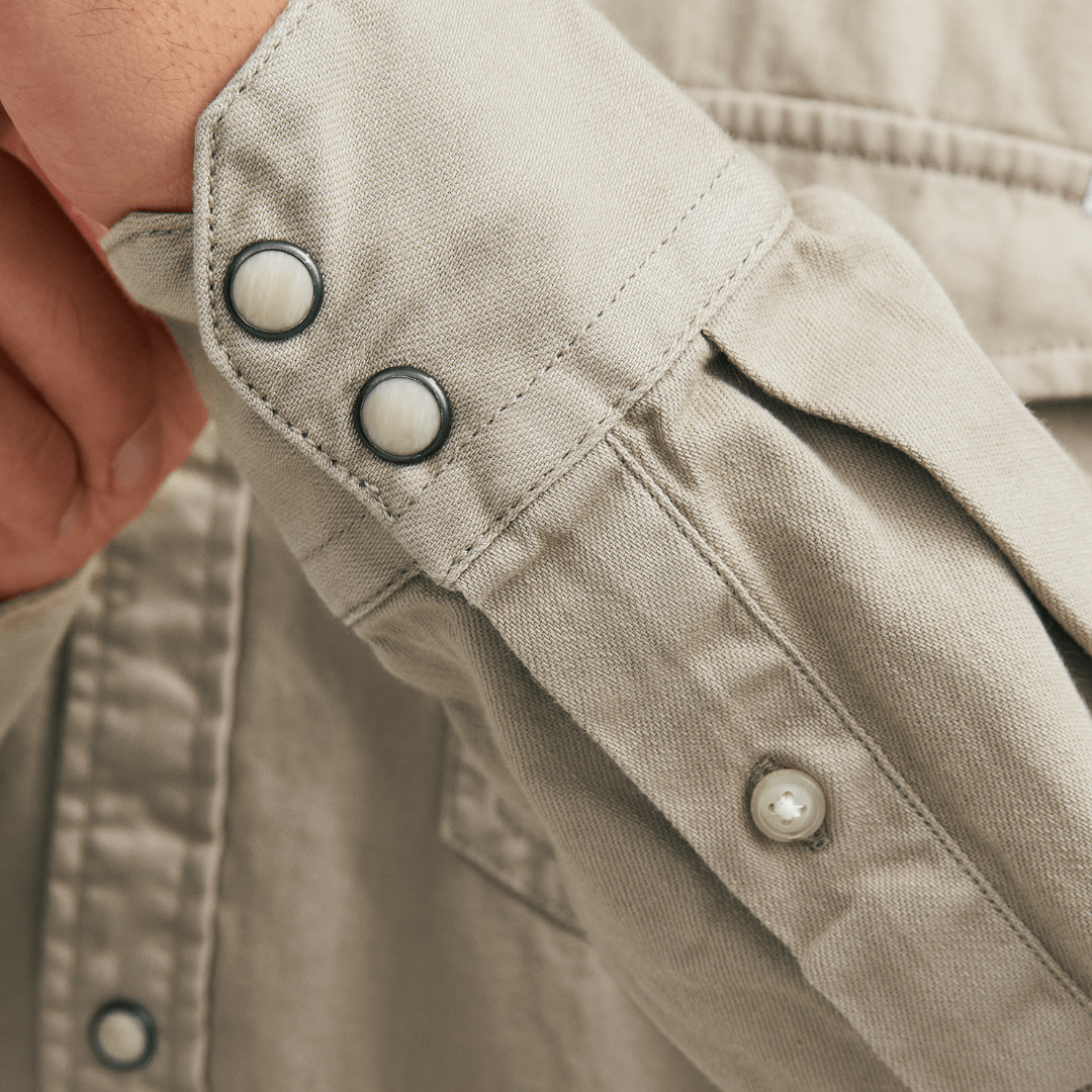 stewarts menswear, Mullumbimby. Jack & Jones SHeridan Denim shirt. Colour is crockery. Photo shoes close up of wrist/cuff with buttons.