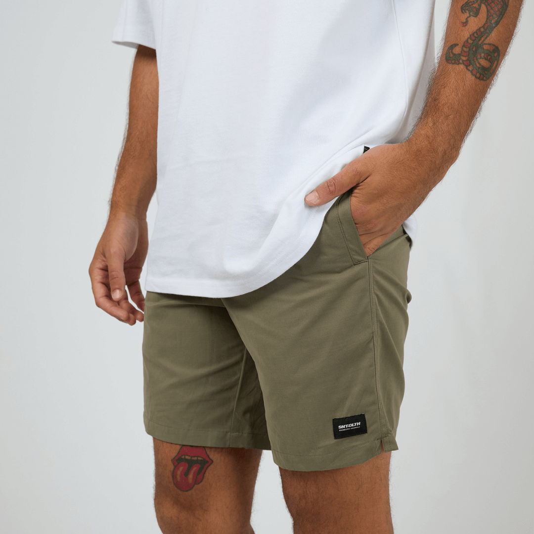 St Goliath Swim Volley Short available at Stewart’s Menswear Mullumbimby. Men’s modern fit swim short with stretch nylon, Velcro back pocket, and branded patch. PHoto shows front view, colour is Olive