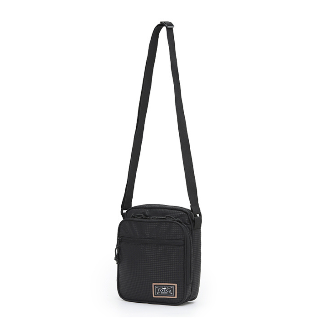 Stewarts Menswear Mullumbimby Tosca cross shoulder bag. This Men's Cross Shoulder Bag is the perfect man-bag for every occasion. This Cross-Body Bag includes one large main compartment and two smaller zippered compartments on front: perfect for your phone, wallet, keys and a water bottle plus it comes with an adjustable strap.