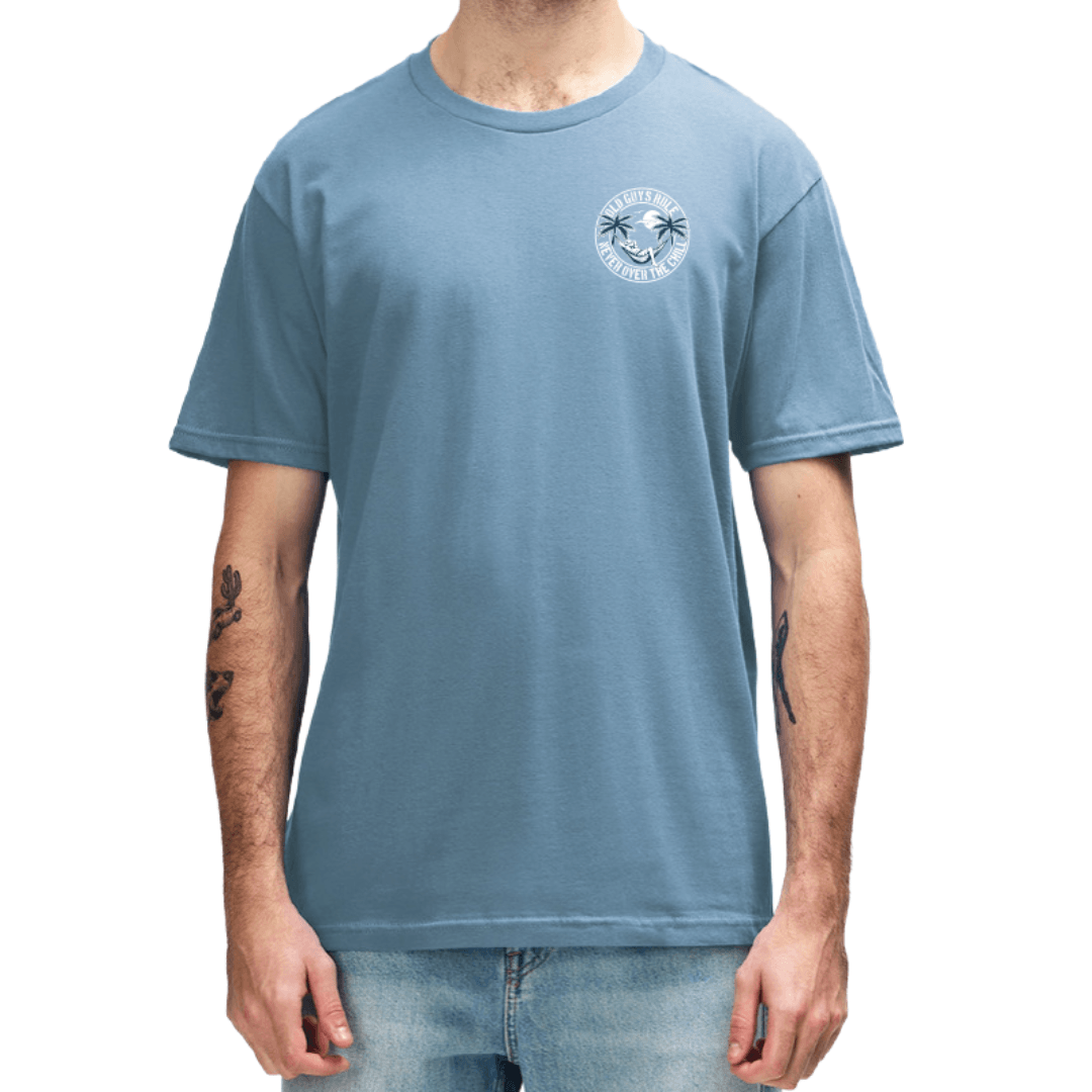 Front view of Old Guys Rule Never Over the Chill Tee in blue, front and back palm tree hammock print available at Stewart's Menswear Mullumbimby.