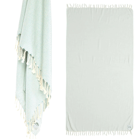 Stewarts Menswear Ozoola Original Beach Towel. The Original Ozoola Towel is made from 100% Turkish Cotton which is super absorbent and fast drying.  Sized at 180 x 100cm with knotted fringing at each end. Ideal for endless beach days, and lazy pool days.  Soft and light, it is perfect for travelling and it can also be used as a sarong.  Colour is MInt.