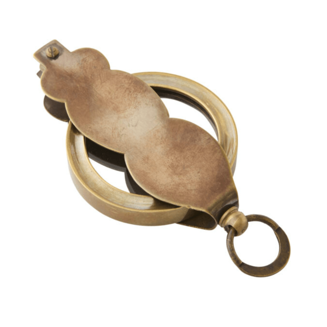 Handmade Folding Magnifier in brass and glass with a folding pocket design, available at Stewart's Menswear Mullumbimby. Shown folded in.