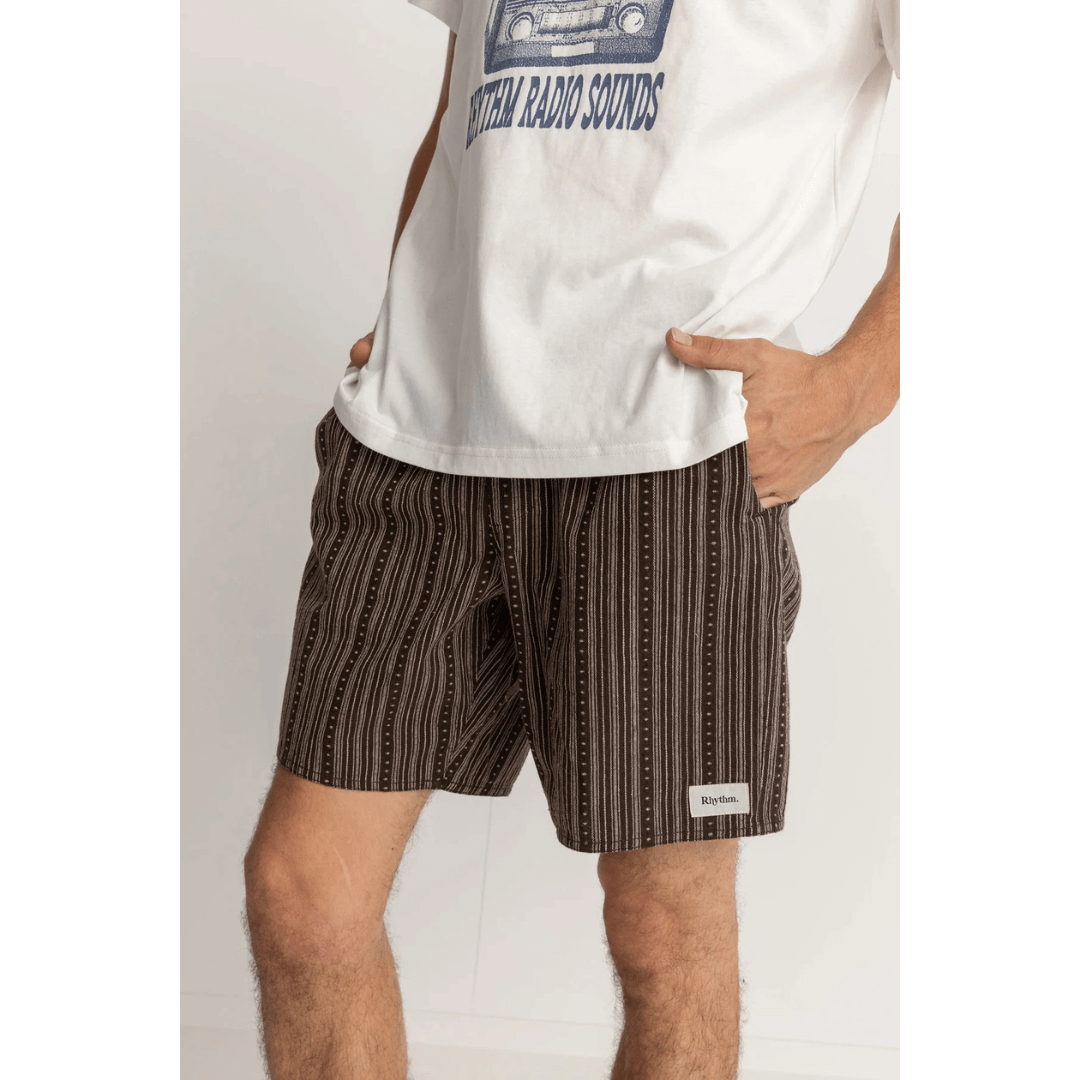 Stewarts Menswear Rhythm Livin Jacquard Linen Jam. Photo shows model wearing Rhythm Jacquard Linen Jam Shorts. Colour is dark brown with unique stripe design.