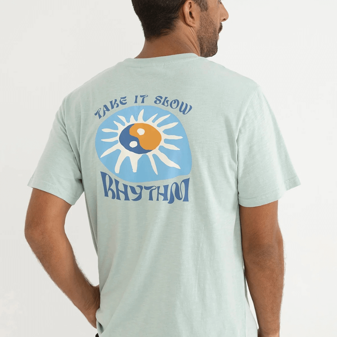 Slow Down Slub t-shirt available at Stewart's Menswear, Mullumbimby. Photo of model wearing Rhythm Slow Down slub tee shirt, back view.