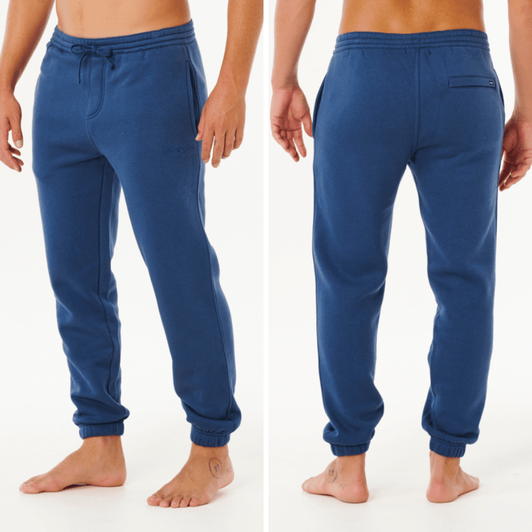 Model wearing Rip Curl Classic Surf Trackpant in light navy. Rip Curl Classic Surf Hoodie and Trackpant bundle available at Stewart's Menswear Mullumbimby — 2 for $140 with free postage.
