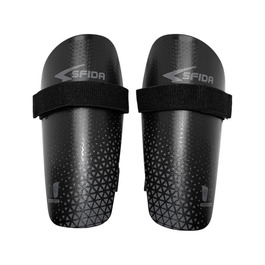 Stewarts Menswear Sfida Shinguards Basic (Black/Grey). Shinguards for football (also known as soccer) players. These are an entry level Unisex shin guard for children and adults, which offer excellent value to the beginner footballer. They are easy to put on and remove and give good protection at an affordable price. Elastic straps with hook and loop closure for a snug, un-moving fit Soft padded backing for comfort Hard external shell for protection