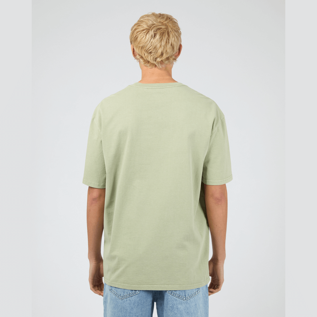 Back view of model wearing mint Silent Theory Essential Tee available at Stewart’s Menswear Mullumbimby. Men’s relaxed fit 100% cotton tee with crew neck and short sleeves.