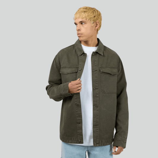 Front view of model wearing Silent Theory Fade Overshirt in Khaki available at Stewart's Menswear, Mullumbimby.