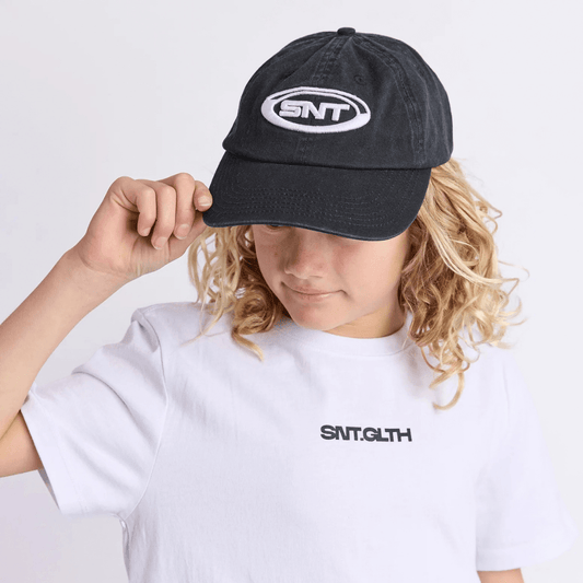 Photo of a boy wearing St Goliath Boys SNT cap in black available from Stewart's Menswear in Mullumbimby