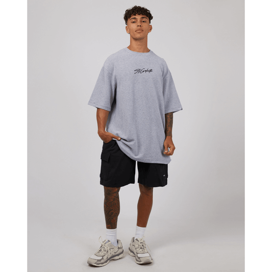 Stewarts Menswear St Goliath Texture Tee. A light coloured t-shirt featuring St Goliath logo embroidered in black. Photo shows model wearing St Goliath Texture Tee.