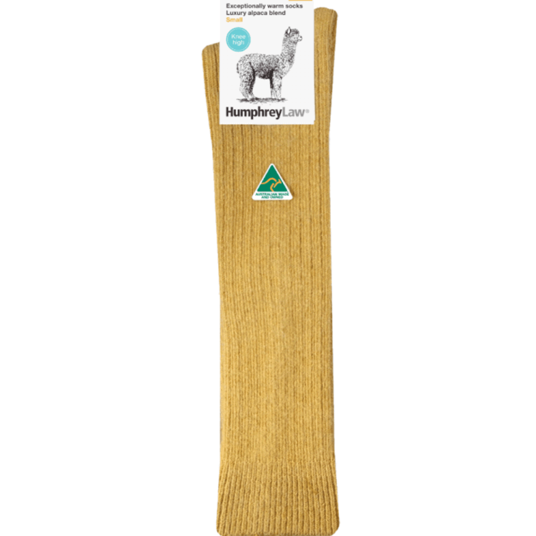Stewarts Menswear Humphrey Law Australian made alpaca/wool blend knee-hi socks. An exceptionally warm luxury knee-high sock made with a blend of alpaca and wool. Alpaca fibre is soft, supple and smooth and contains microscopic air pockets which act as insulators keeping in the warmth provided by the wool. Please note as alpaca is a luxury fibre these socks are not recommended for high abrasion use such as work boots. Colour is Empire Yellow, a mustardy yellow colour.