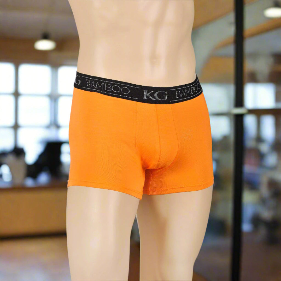 Photo shows mannequin wearing orange Kingston Grange boxer shorts.