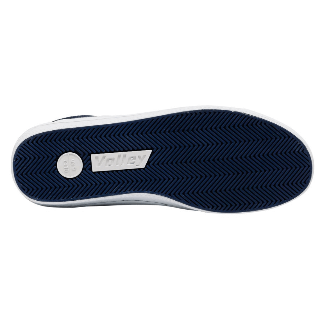 Stewart's Menswear Dunlop Volley Classic shoe. Whether you're dressing up or down, Dunlop Volleys are versatile and will add retro style to your outfit. The simple design features a canvas upper with a moulded rubber toe cap and a contrasting stripe on the side. The shoe's original herringbone rubber outsole is slip resistant and non-marking. White Sole view.