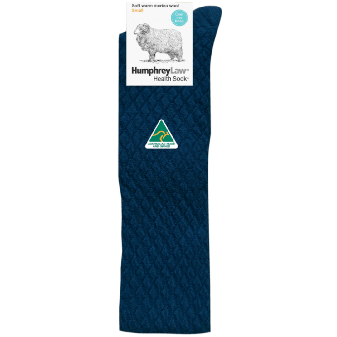 Stewarts Menswear Humphrey Law Australian Made socks. 95% merino wool ladies over the knee health sock. A new addition to the Humphrey Law range is this soft warm merino wool ladies’ sock with a quilted pattern. Made with 95% Fine Merino wool blended with a small amount of nylon to reinforce the heels and toes for longer wear. An extremely comfortable, warm , luxury soft wool sock. Colour is Junior Navy.