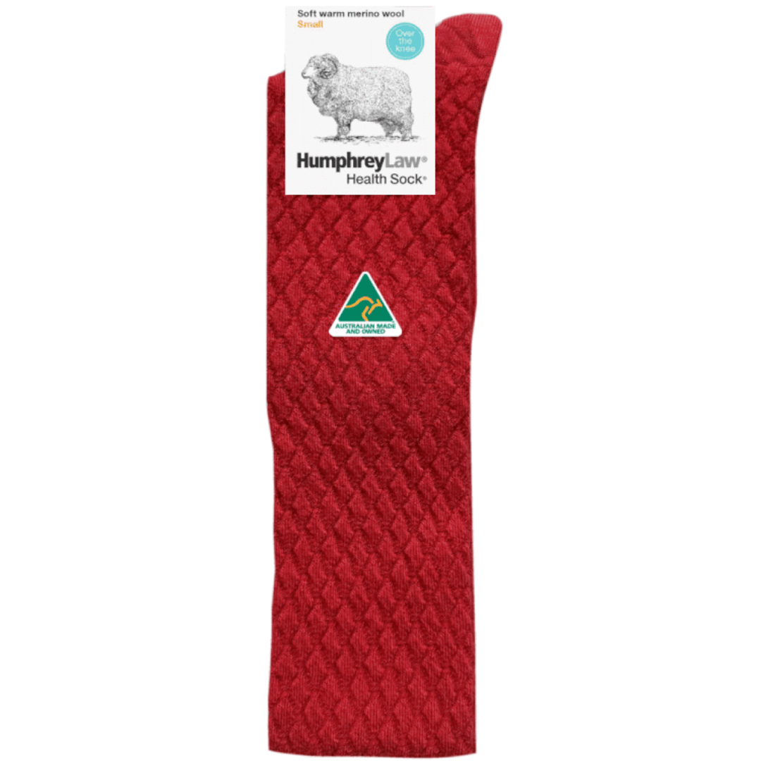 Stewarts Menswear Humphrey Law Australian Made socks. 95% merino wool ladies over the knee health sock. A new addition to the Humphrey Law range is this soft warm merino wool ladies’ sock with a quilted pattern. Made with 95% Fine Merino wool blended with a small amount of nylon to reinforce the heels and toes for longer wear. An extremely comfortable, warm , luxury soft wool sock. Colour is Red.