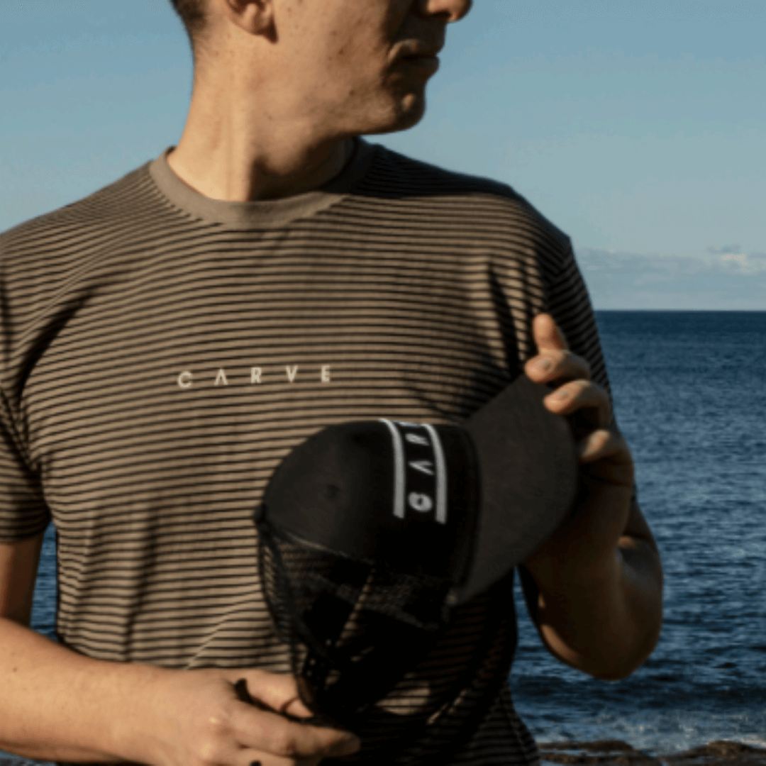 Look hot and stay cool in a 100% cotton Tee-shirt from Carve surf wear.  This is a regular fit men's short sleeve T-shirt with small stripe all over.   Perfect for a day at the beach, afternoon drinks at the pub or any other weekend adventure.  160g Combed cotton jersey. Colour is Fossil with black stripes.