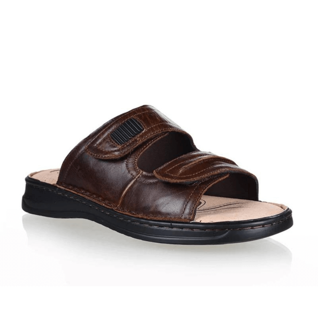 Stewart's Menswear Woodlands Gerard Leather slide. Gerard leather slides by Woodlands are the perfect everyday leather slide for men. With adjustable straps, they fit any foot. Whether you have a narrow or wide foot, you can easily adjust the straps to ensure a perfect fit. Features a leather upper and lining plus the padded insole will keep your feet feeling comfortable all day long. Side view