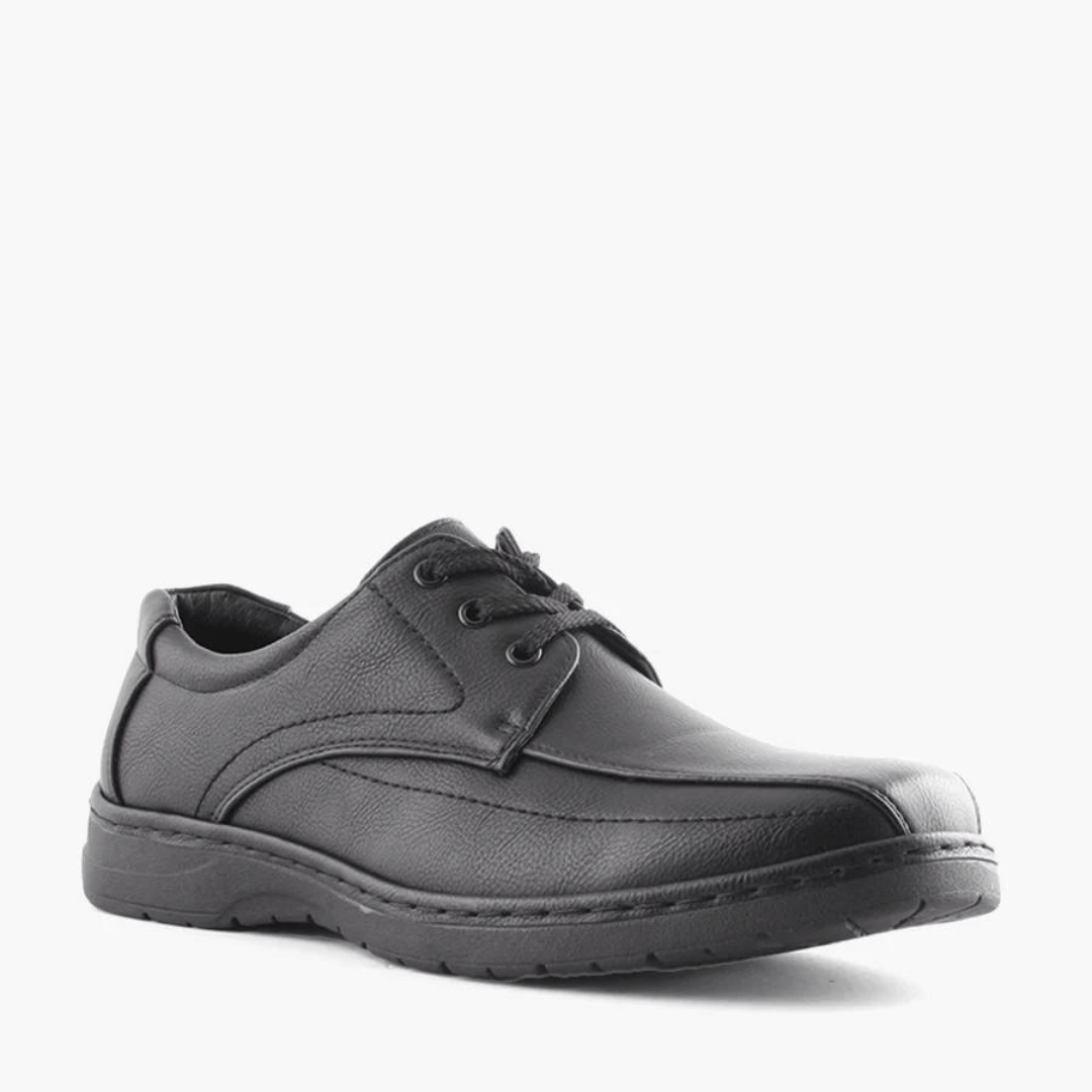Stewart's Menswear Woodlansd Luai Men's lace up shoe. Luai by Woodlands is a men's lace-up shoe which features patterned stitching and a cushioned collar with a durable rubber outsole. Man-made upper, lining and sole. Front View, Colour is black.