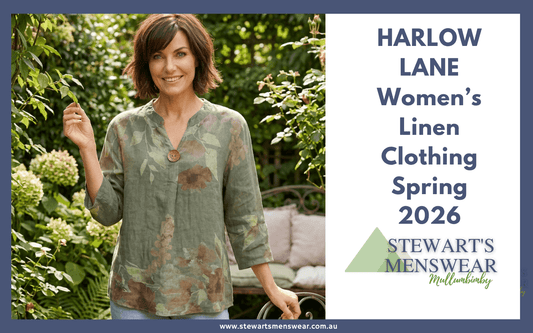 Woman wearing an olive floral linen top with denim jeans, standing in a garden, part of the Harlow Lane range at Stewart's Menswear.