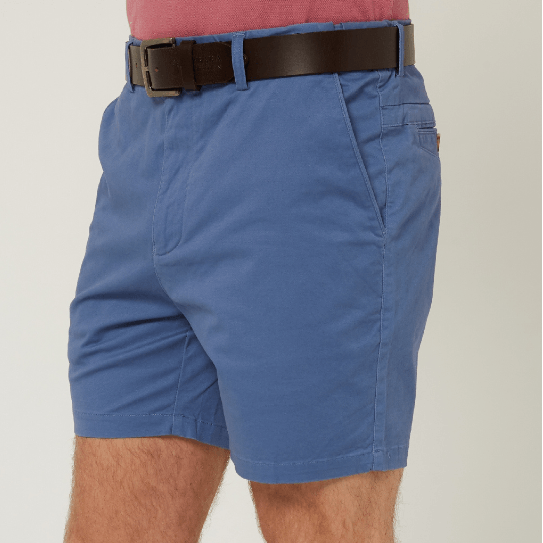 Model wearing men's Pilbara chino shorts by Ritemate in Copen Blue (light blue), classic fit with action waistband, available at Stewart's Menswear