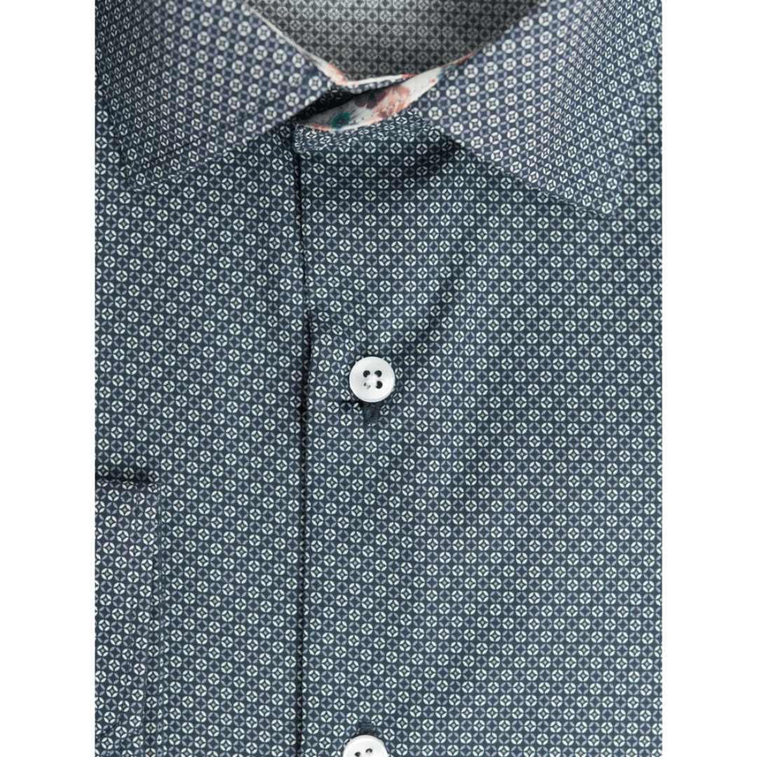 Stewarts Menswear Varce long sleeve shirt. Colour is Charcoal with black and white geometric pattern. Made from 100% cotton and featuring modern prints with a contrast print inside collar and cuffs, these shirts are perfect for the transition from Winter to Spring and can be dressed up or down depending on the occasion. Photo shows close up view of print.