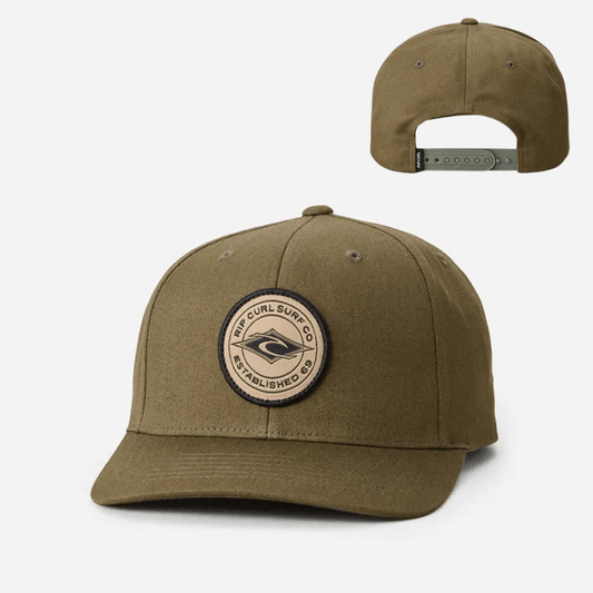 Stewart's Menswear, Mullumbimby. Product photo of Rip Curl Stapler Cap. Dark tan colour with curved peak and embroidered Rip Curl badge on front.