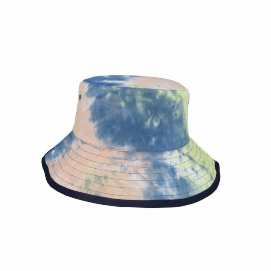 Brodie Reversible Tie Dye Cotton Bucket Hat for kids with wide brim and UPF 50+, available at Stewart’s Menswear Mullumbimby. Tie dye pattern on one side, plain navy on the other side.