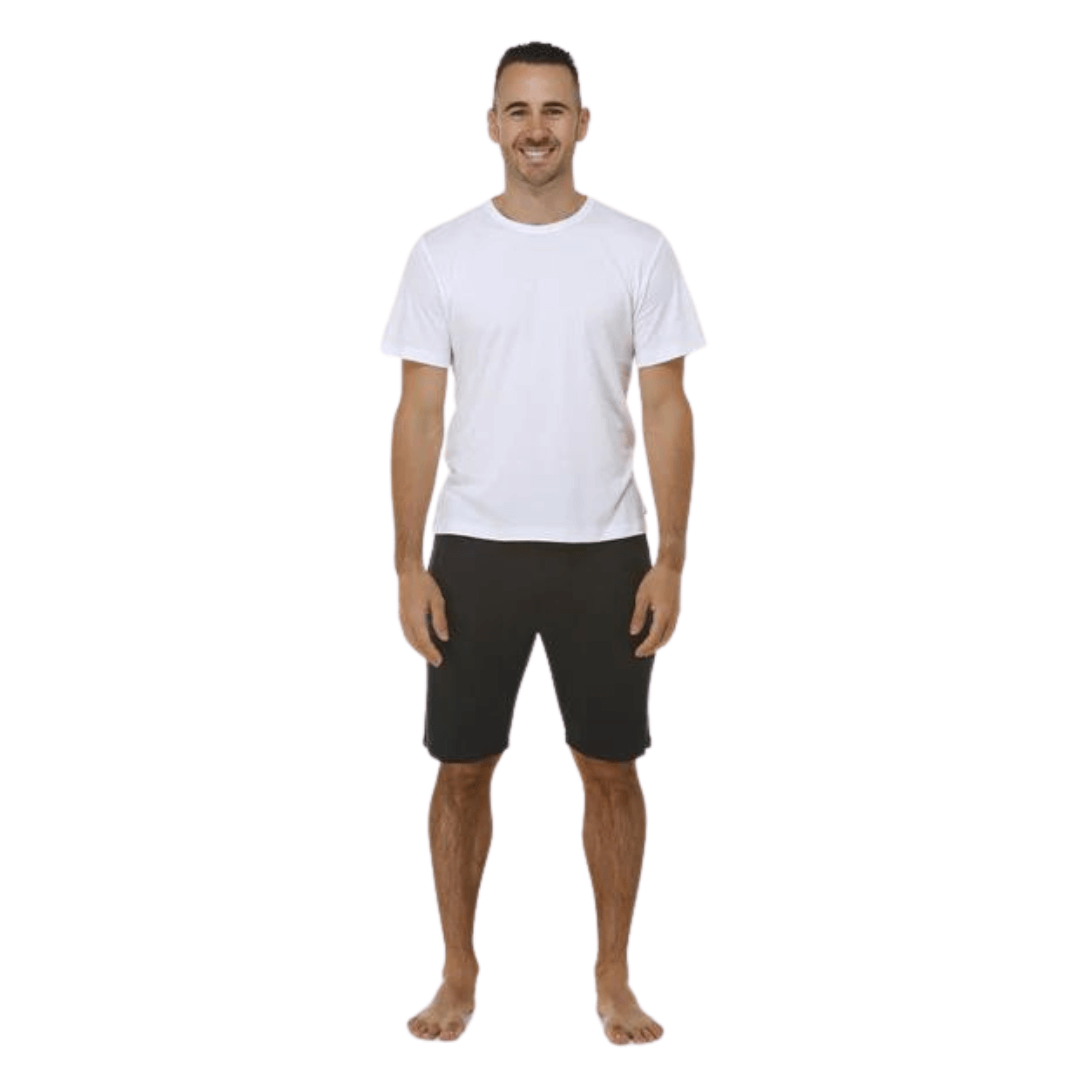 Stewarts Menswear Bamboozled bamboo jersey sleep shorts.  Made from a sustainable Bamboo blend, they are luxuriously soft and breathable and will have you feeling relaxed in no time at all. Elasticised waist with front tie. Photo shows model wearing black sleep shorts with white t-shirt.