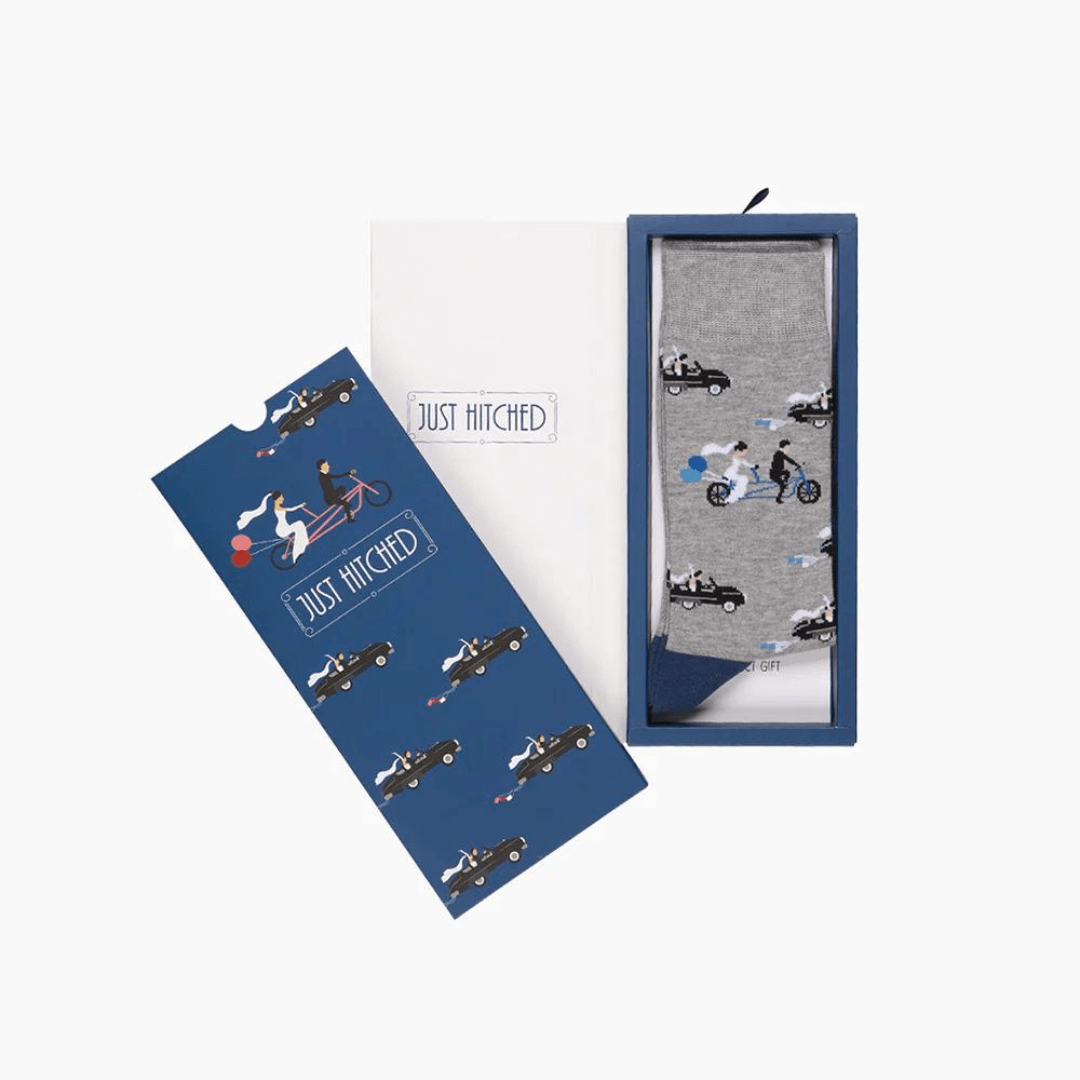 Stewarts Menswear Bamboozld Socks. Sock gift card. Not only do you get a quality pair of Bamboo blend socks the recipient will love, but it comes packed in a matching Gift Card. Marriage themed socks featuring Bride & Groom driving away  all over packed in a matching "Just HItched!" gift card.